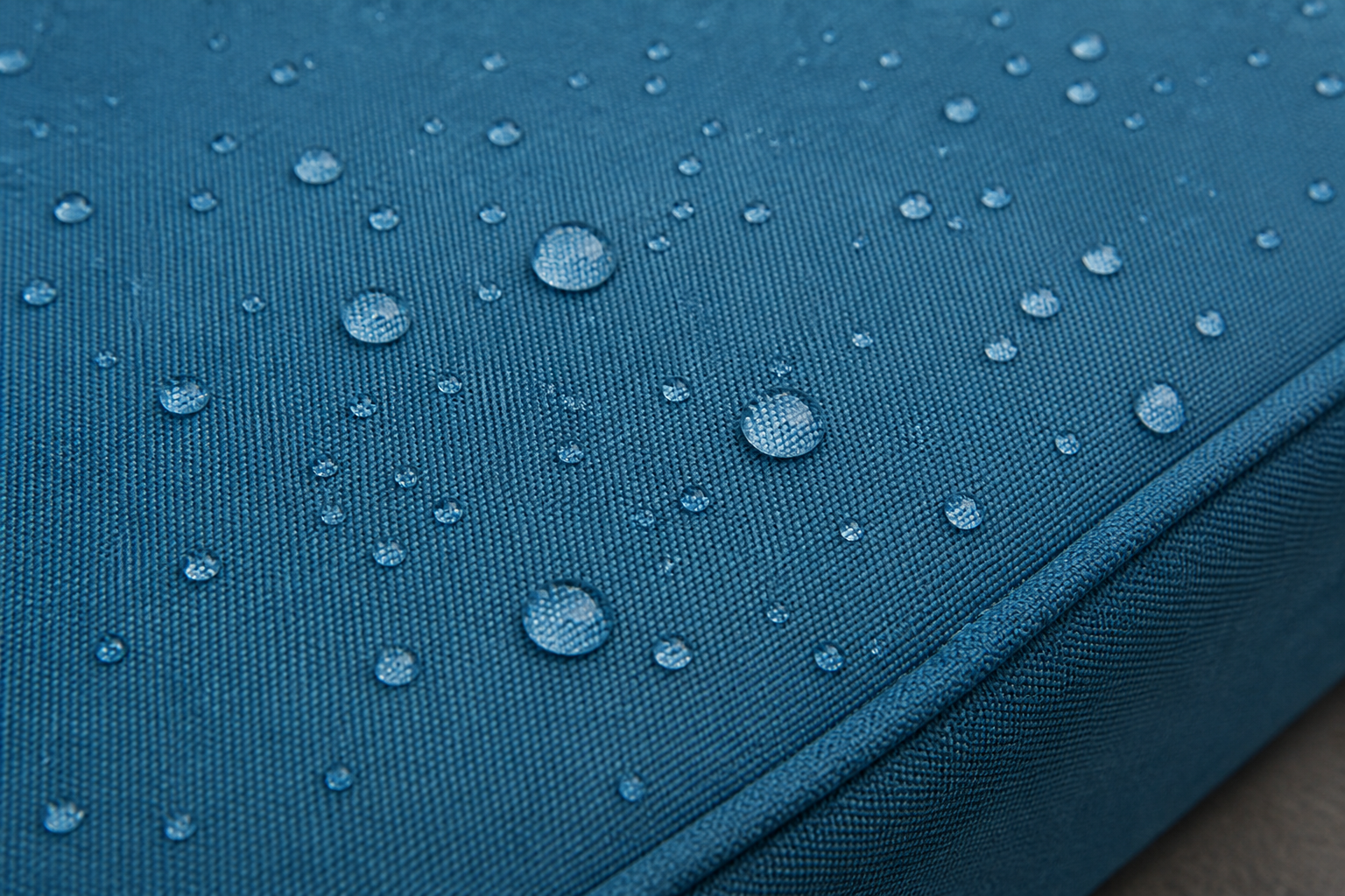 Enhancing custom cushion longevity with premium, weather-resistant fabric.